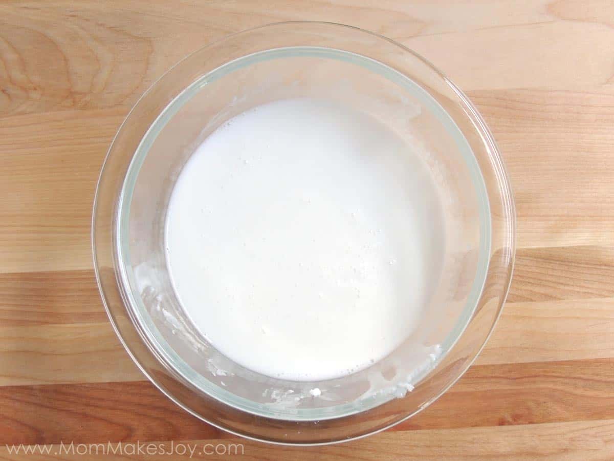 Goat's milk soap base melted in a glass bowl
